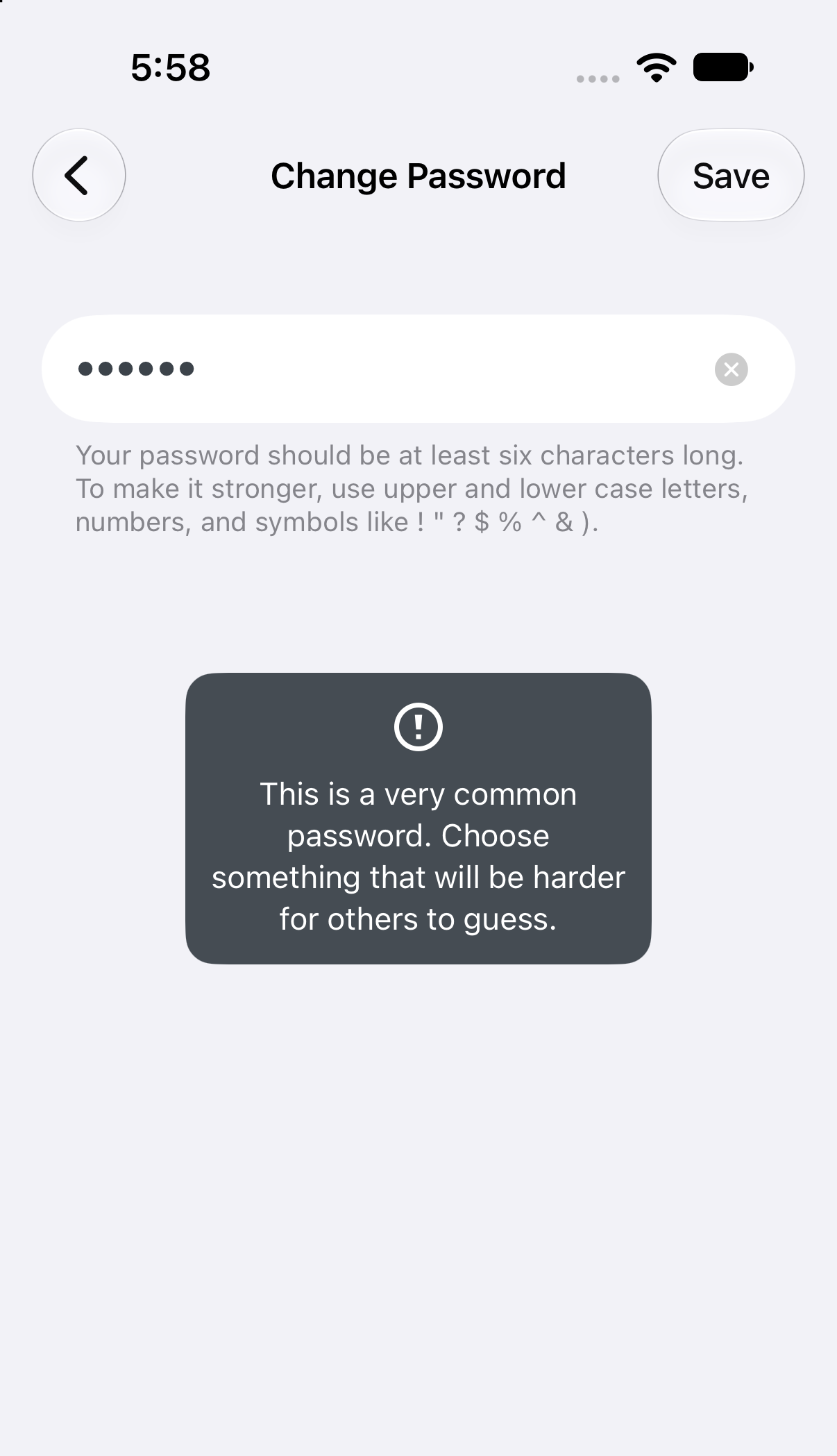 Change Password screen with a dark popup: “This is a very common password. Choose something that will be harder for others to guess.”